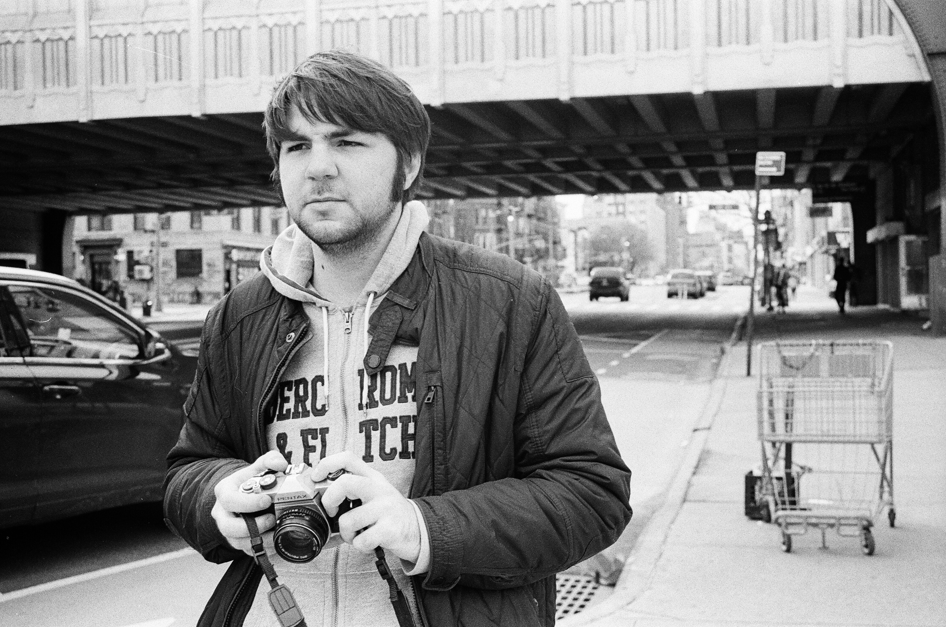 Leo engaging in film photography